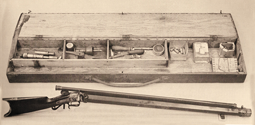 A .55 caliber G.H. Ferriss (Utica, New York) bench rest rifle, 313⁄8-inch barrel, 1.695 across the flats, re-cut from a cloth patch picket rifle to paper patch bullet rifle by R.R. Moore of Cortland, New York. Reloading tools by Ferriss and Moore. Photo from the Richard Bourne Auction Co. 1980 catalog.